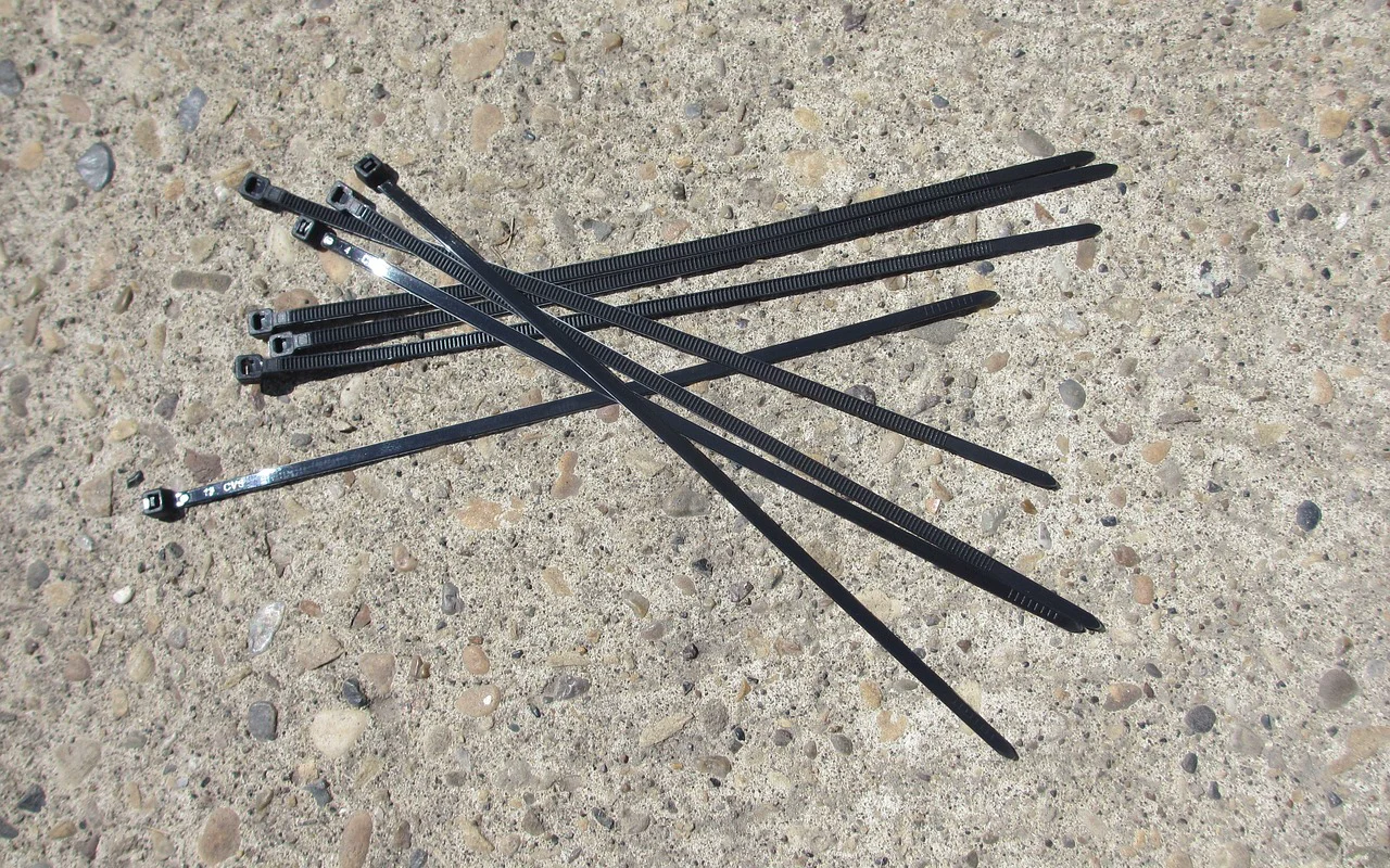 Black nylon cable ties on a flight case — standard crew material at every event