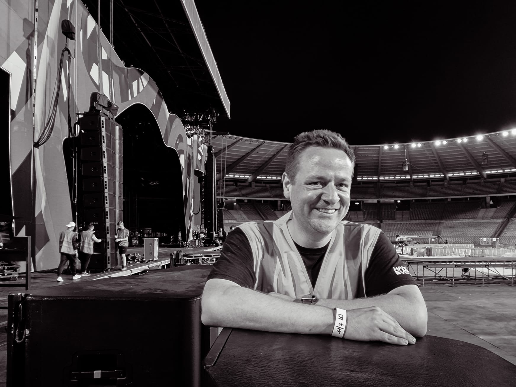 Owner Radja Gios backstage in an arena after load-in